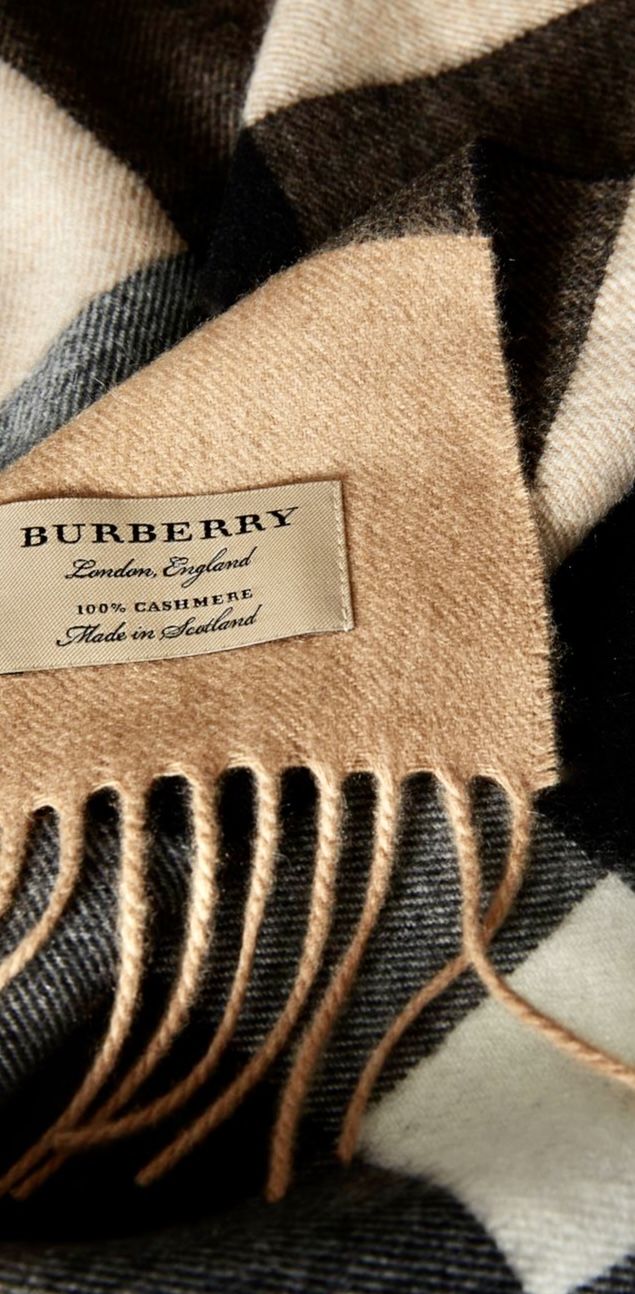 A check cashmere scarf showing the Burberry label and fringe